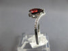 1.18CT DIAMOND & AAA GARNET 14KT WHITE GOLD PEAR SHAPE & ROUND CRISS CROSS RING