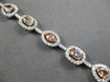 LARGE GIA 6.56CT MULTI COLOR DIAMOND 18KT WHITE & ROSE GOLD HALO TENNIS BRACELET