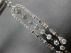 LONG 1.25CT DIAMOND 14KT WHITE GOLD ROUND & BAGUETTE HORSESHOE HANGING EARRINGS