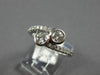 ESTATE .68CT DIAMOND 14KT WHITE GOLD CLASSIC BEZEL 2 STONE CRISS CROSS LOVE RING