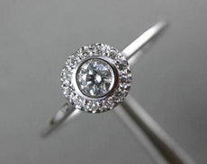 ESTATE .15CT DIAMOND 18KT WHITE GOLD CLASSIC FLOWER HALO BEZEL FRIENDSHIP RING