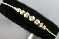 .34CT DIAMOND 14KT YELLOW GOLD 7 STONE GRADUATING BEZEL ADJUSTABLE LOVE BRACELET