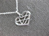 ESTATE .01CT DIAMOND 14K WHITE GOLD ROUND CRISS CROSS HEART FUN FLOATING PENDANT