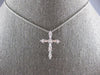 .33CT DIAMOND 18KT WHITE GOLD 3D CLASSIC ROUND & BAGUETTE CROSS FLOATING PENDANT
