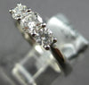 .64CT DIAMOND 18KT WHITE GOLD ROUND 3 STONE PAST PRESENT FUTURE ENGAGEMENT RING