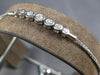 .34CT DIAMOND 18K WHITE GOLD 7 STONE BEZEL GRADUATING ADJUSTABLE TENNIS BRACELET