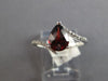 1.18CT DIAMOND & AAA GARNET 14KT WHITE GOLD PEAR SHAPE & ROUND CRISS CROSS RING