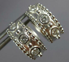ESTATE .61CT DIAMOND 14KT WHITE GOLD ROUND ETOILE BEZEL 3 STONE HUGGIE EARRINGS