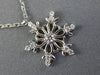 ESTATE .16CT DIAMOND 14KT WHITE GOLD 3D SNOWFLAKE FLOATING LOVE PENDANT