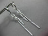 ESTATE LONG .28CT DIAMOND 14KT WHITE GOLD INFINITY LOVE HUGGIE HANGING EARRINGS