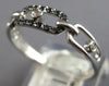 ESTATE .09CT WHITE & BLACK DIAMOND 14KT WHITE GOLD 3D OVAL LOVE KNOT FUN RING