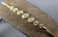 .34CT DIAMOND 18KT YELLOW GOLD 3D BEZEL 7 STONE GRADUATING LOVE TENNIS BRACELET