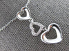 .06CT DIAMOND 14KT WHITE GOLD 3D OPEN HEART JOURNEY PAST PRESENT FUTURE PENDANT