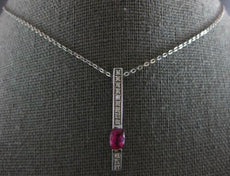 1.22CT DIAMOND & AAA RUBY 14KT WHITE GOLD OVAL & ROUND BAR LOVE FLOATING PENDANT