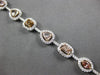 LARGE GIA 6.56CT MULTI COLOR DIAMOND 18KT WHITE & ROSE GOLD HALO TENNIS BRACELET