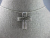ESTATE. 75CT DIAMOND 18KT WHITE GOLD 3D CLASSIC THREE ROW CROSS FLOATING PENDANT