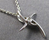 SMALL .01CT DIAMOND 18KT WHITE GOLD CRISS CROSS SOLITAIRE CROSS FLOATING PENDANT