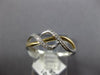 ESTATE .06CT DIAMOND 14KT WHITE AND YELLOW GOLD 3D CLASSIC INFINITY LOVE RING