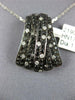 1.10CT WHITE AND BLACK DIAMOND 18K WHITE GOLD TRIANGULAR CRISS CROSS FUN PENDANT