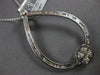 1.37CT DIAMOND 14KT WHITE GOLD ROUND & BAGUETTE OPEN TEAR DROP FLOATING PENDANT