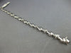 ESTATE .50CT DIAMOND 14K WHITE GOLD BEZEL ETOILE CRISS CROSS FUN TENNIS BRACELET