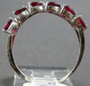 .91CT DIAMOND & AAA RUBY 18KT WHITE GOLD PEAR SHAPE & ROUND CRISS CROSS RING