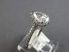 .86CT DIAMOND 14KT WHITE GOLD 3D CLASSIC PEAR SHAPE & ROUND HALO ENGAGEMENT RING