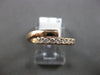 ESTATE .26CT DIAMOND 14KT ROSE GOLD 3D CLASSIC 5MM CRISS CROSS LOVE RING