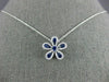ESTATE .63CT DIAMOND & AAA SAPPHIRE 18KT WHITE GOLD FLOWER FLOATING LOVE PENDANT