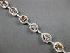 LARGE GIA 6.56CT MULTI COLOR DIAMOND 18KT WHITE & ROSE GOLD HALO TENNIS BRACELET