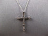 .33CT DIAMOND 18KT WHITE GOLD 3D CLASSIC ROUND & BAGUETTE CROSS FLOATING PENDANT