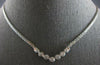 ESTATE .65CT DIAMOND 14KT WHITE GOLD 7 STONE BEZEL ETOILE V SHAPE LOVE NECKLACE