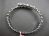 2.67CT DIAMOND 18K WHITE GOLD OVAL BEZEL INVISIBLE SEMI ETERNITY BANGLE BRACELET
