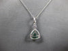 .50CT DIAMOND & AAA EMERALD 18KT WHITE GOLD 3D TRILLION & ROUND FLOATING PENDANT