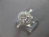 .82CT DIAMOND 18KT WHITE GOLD 3D CLASSIC ROUND CLUSTER HALO OVAL FRIENDSHIP RING