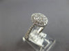 .82CT DIAMOND 18KT WHITE GOLD 3D CLASSIC ROUND CLUSTER HALO OVAL FRIENDSHIP RING