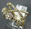 LARGE .99CT DIAMOND 14KT YELLOW GOLD ROUND & BAGUETTE MULTI FLOWER INFINITY RING