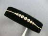 .34CT DIAMOND 14KT YELLOW GOLD 7 STONE GRADUATING BEZEL ADJUSTABLE LOVE BRACELET