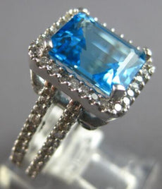6.40CT DIAMOND & AAA BLUE TOPAZ 14KT WHITE GOLD 3D EMERALD CUT & ROUND HALO RING