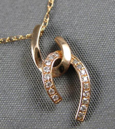ESTATE .05CT DIAMOND 14KT ROSE GOLD CLASSIC LOVE KNOT FLOATING FLOATING PENDANT
