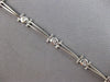 .26CT DIAMOND 14KT WHITE GOLD ROUND BEZEL ETOILE TRIANGULAR FUN TENNIS BRACELET