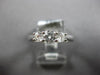 .64CT DIAMOND 18KT WHITE GOLD ROUND 3 STONE PAST PRESENT FUTURE ENGAGEMENT RING