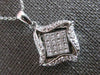 .52CT DIAMOND 18KT WHITE GOLD ROUND & PRINCESS INVISIBLE SQUARE FLOATING PENDANT