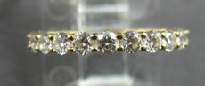 ESTATE .16CT DIAMOND 18KT WHITE GOLD ROUND BEZEL GRADUATING 7 STONE WEDDING RING