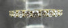ESTATE .16CT DIAMOND 18KT WHITE GOLD ROUND BEZEL GRADUATING 7 STONE WEDDING RING