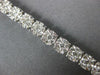 ESTATE WIDE 4.05CT DIAMOND 14KT WHITE GOLD CLUSTER ROUND 4 PRONG TENNIS BRACELET