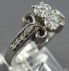 ESTATE .59CT DIAMOND 14KT WHITE GOLD ROUND 2 STONE INFINITY FILIGREE LOVE RING