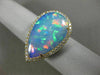 ESTATE EXTRA LARGE 8.13CT DIAMOND & AAA OPAL 14KT YELLOW GOLD CLASSIC HALO RING