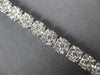 ESTATE WIDE 4.05CT DIAMOND 14KT WHITE GOLD CLUSTER ROUND 4 PRONG TENNIS BRACELET