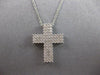 ESTATE. 75CT DIAMOND 18KT WHITE GOLD 3D CLASSIC THREE ROW CROSS FLOATING PENDANT